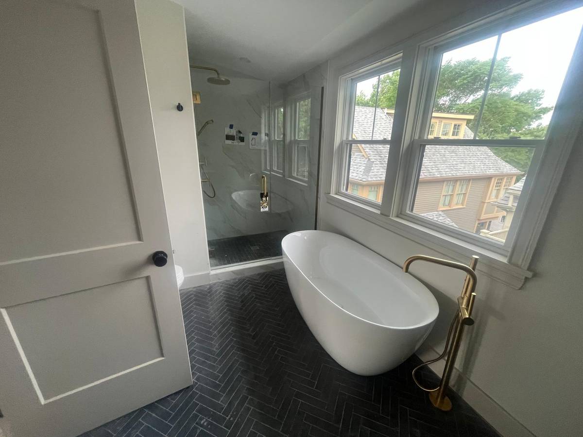 Kingdom Construction freestanding tub and walk-in shower